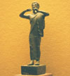 Bronze piper statuette