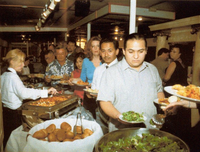 Guests at the Buffet Table in the main salon At the front of the line are 